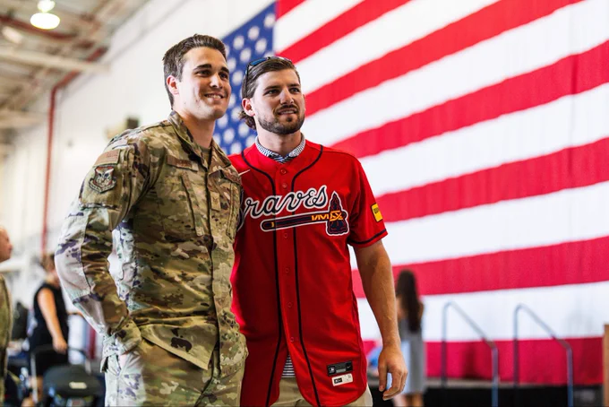 Austin Riley takes a photo with military member