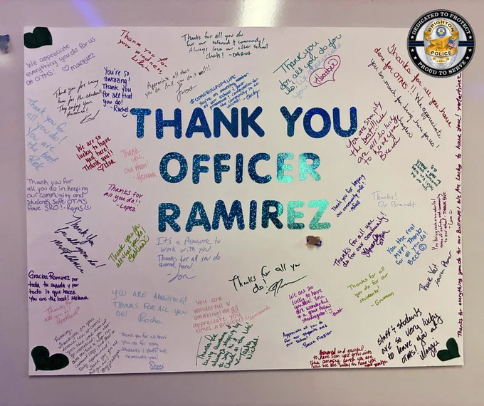 Large white poster with blue glitter letters reading 'THANK YOU OFFICER RAMIREZ' surrounded by colorful handwritten thank you notes and hearts.