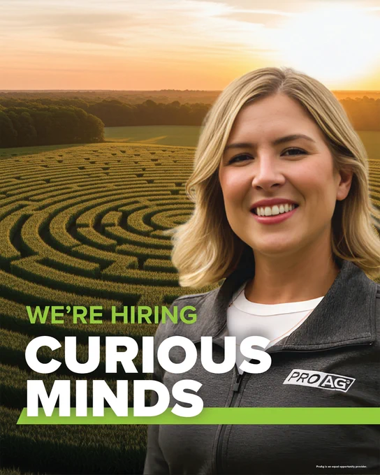 A person is smiling in front of a scenic landscape featuring a large, intricate hedge maze and a sunset sky. The text reads "We're Hiring Curious Minds" with a "ProAg" crop insurance company logo on the person's jacket. ProAg is an equal opportunity provider and employer. 