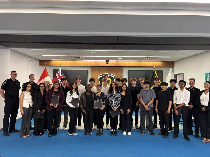 Group photo of the Police Ethnic and Cultural Education (PEACE) Youth Leadership Program graduates.