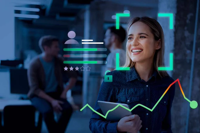 A smiling woman in an office with digital cybersecurity overlays including a user profile icon, a padlock, a line graph, and facial framing.