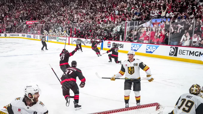 Photo of everyone celebrating after Seth Jarvis's game winning goal 