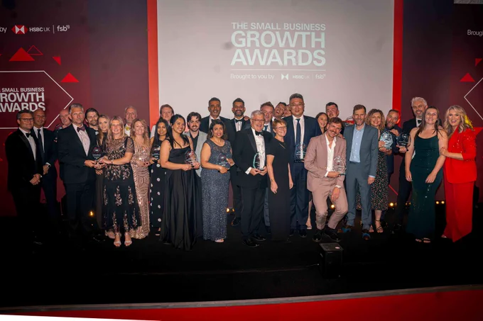 Photograph of all of the national final award winners with host Sara Davies. 