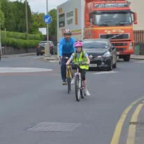 Image of cyclists on a main road.