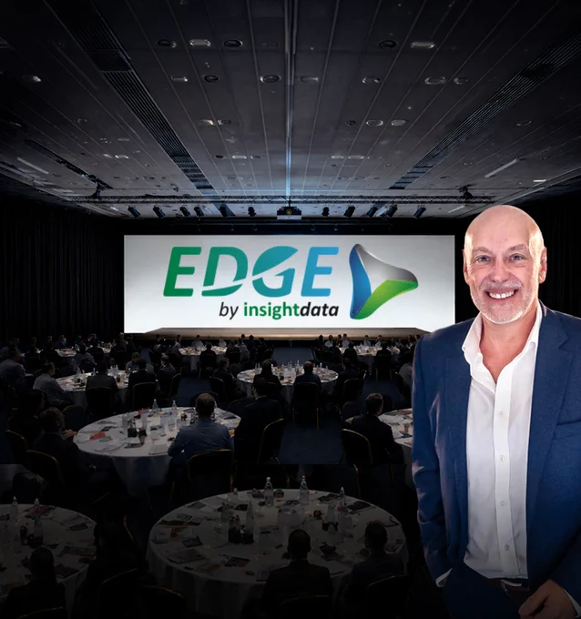 A conference scene featuring a speaker and the EDGE by Insight Data logo projected on a screen. The mood is professional and formal.