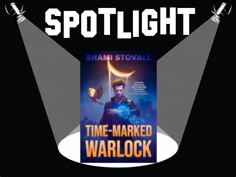 On a black background, under the word 'Spotlight' a pair of spotlights shine on the cover of Time-Marked Warlock by Shami Stovall