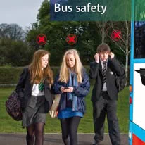 Image of School Children at a bus stop.