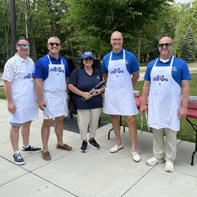 Our grill masters with Board President Debbie Callihan