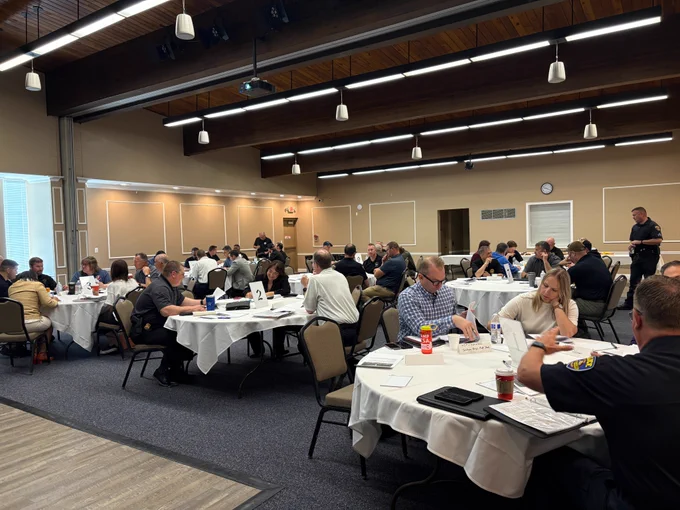 exercise participants sittings in room at separate tables
