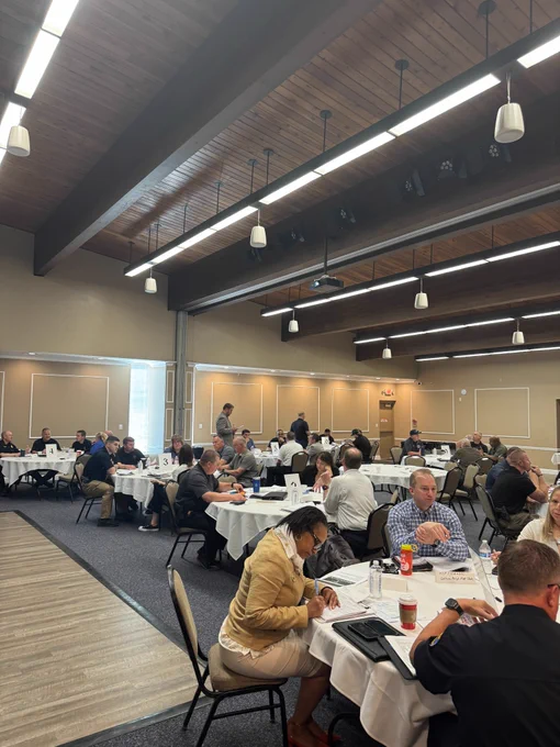 exercise participants sittings in room at separate tables