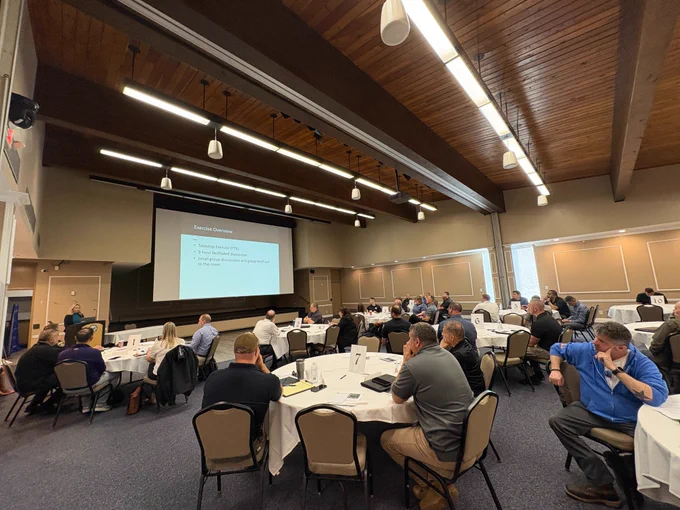 exercise participants sittings in room at separate tables