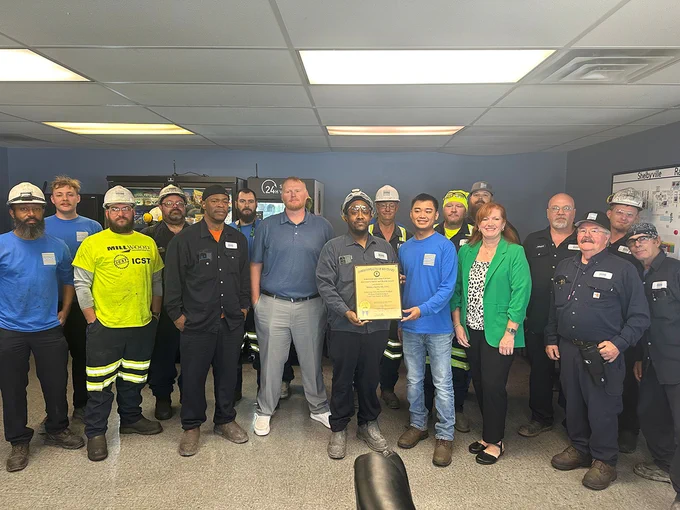 Group photo featuring Matalco - Shelbyville employees receiving a Governor's Safety and Health Award from KYSAFE Director Lynn Whitehouse.