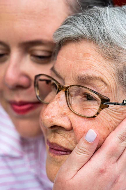 Close portrait of a caring bond between a woman and senior woman.
