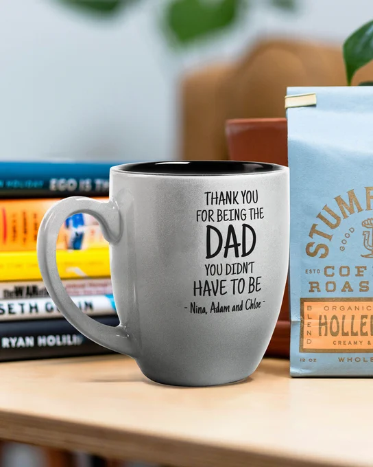 Custom Silver Bistro Mug Engraved With Dad Appreciation Message And Kids Names On Office Desk Near Books And Coffee
