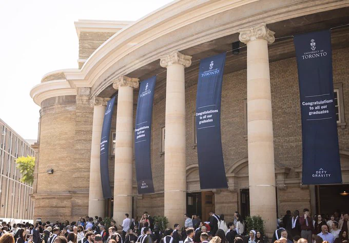 Outdoor image of U of T Convocation Hall during convocation season
