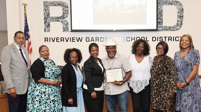 Sultan Muhammad receives the Riverview Excellence Award at the May 26 BOE meeting. 
