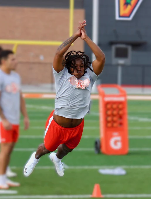 Malachi Lane performing a broad jump