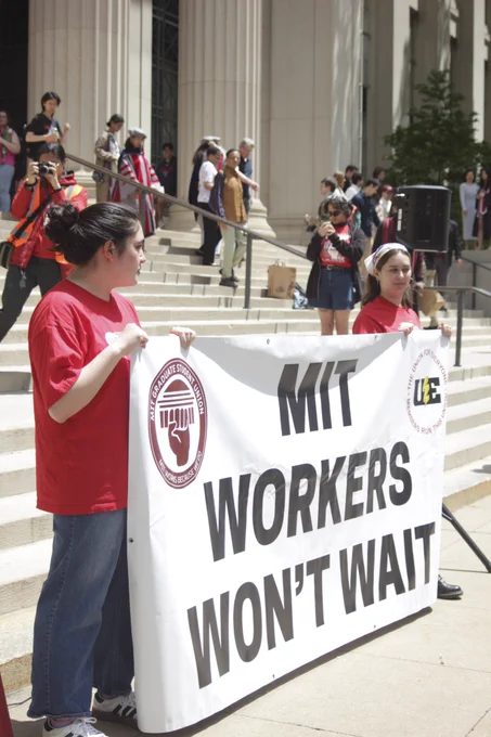 MIT WORKERS WONT WAIT banner held by two local leaders