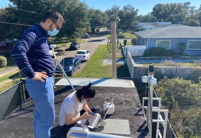 Rsearchers instal PurpleAir Monitors at Hillsborough County air monitoring site.