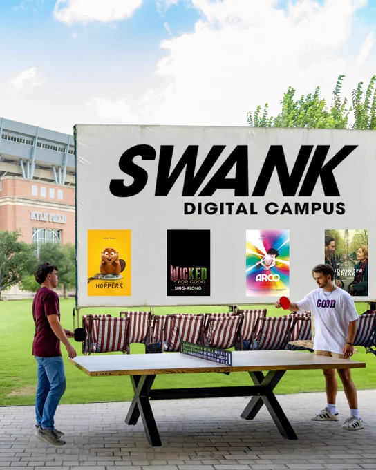Swank Digital Campus. Movie screen set up outside in a park. 