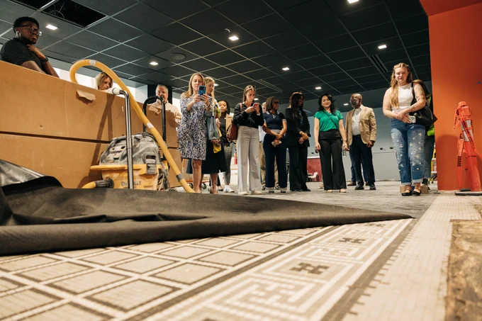 The floor is uncovered to show the original tile. 