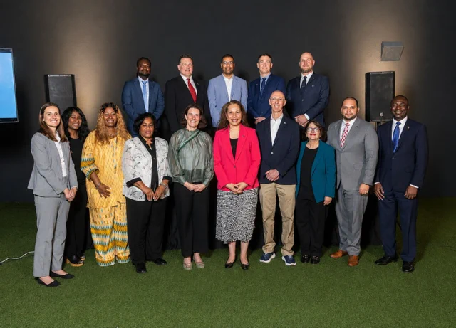 A photo of Commissioner Knight with business leaders, Global NY personnel, and local electeds.