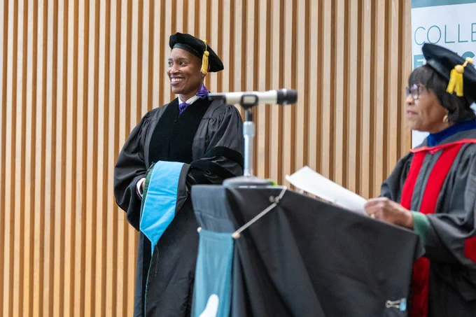 New graduate smiles out at crowd