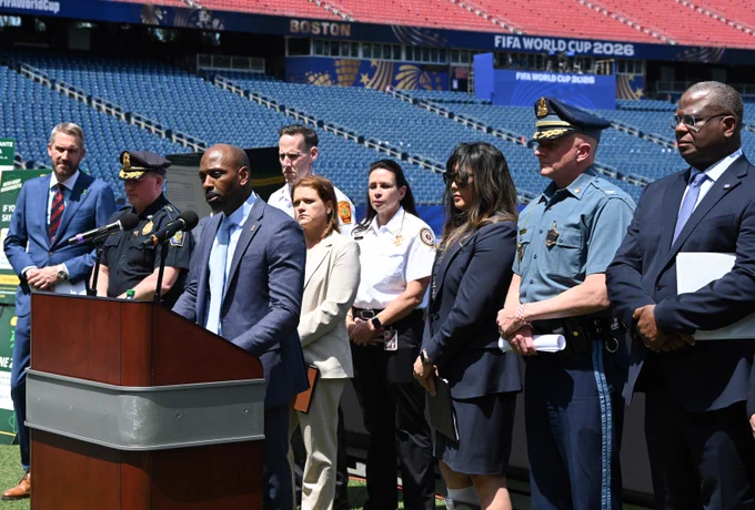 Image is a photo of Special Agent in Charge Ted Docks Speaking at  A FIFA news conference. 