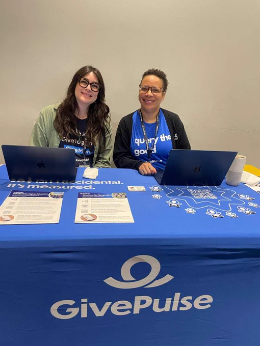 Lindsey and Yesenia at the GivePulse booth at the SEE IGNITE Conference