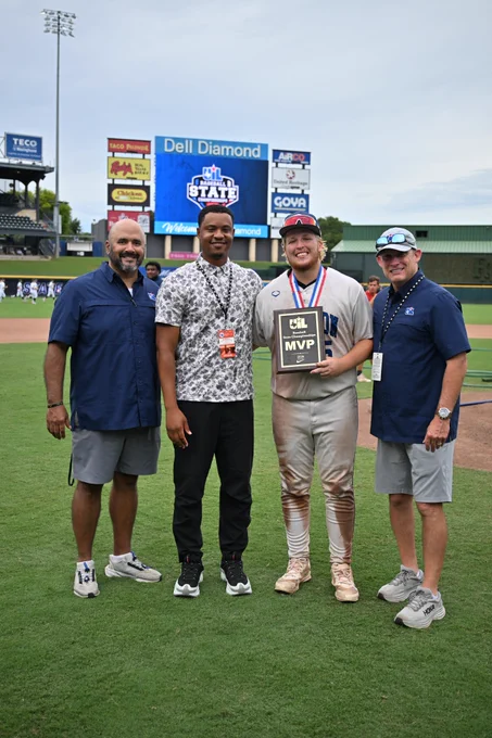 Caden Coe posed with UIL Staff and award plaque.