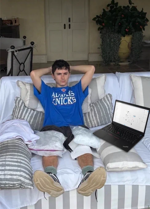 Meme image of Timothée Chalamet icing his knees on a couch with a laptop after the New York Knicks win
