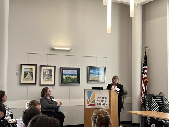 Betsy Eiserman, Accessible Ohio Specialist, welcomes participants to the Accessible Ohio Southwest Regional Event at Northwest Branch of the Dayton Metro Library.