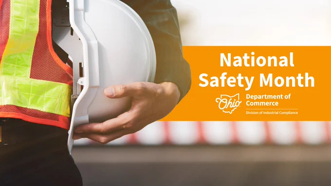A person holds a white hard hat while wearing a safety vest. The image includes the text "National Safety Month" and "Ohio Department of Commerce, Division of Industrial Compliance" on an orange background.