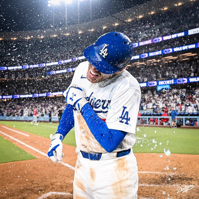 A photo of Freddie Freeman getting splashed with water.