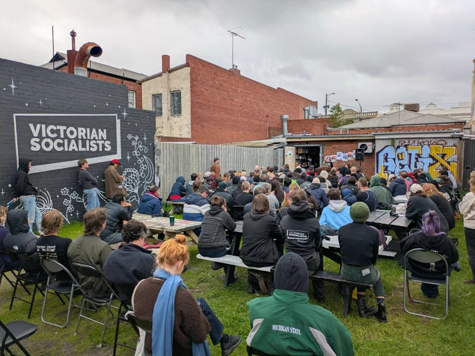 VS members listen to the introduction in the rear yard of the party's volunteer centre in Brunswick