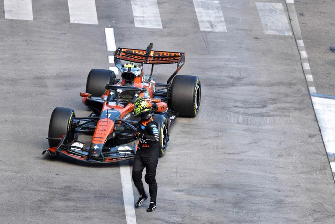 Lando Norris walking away from his car