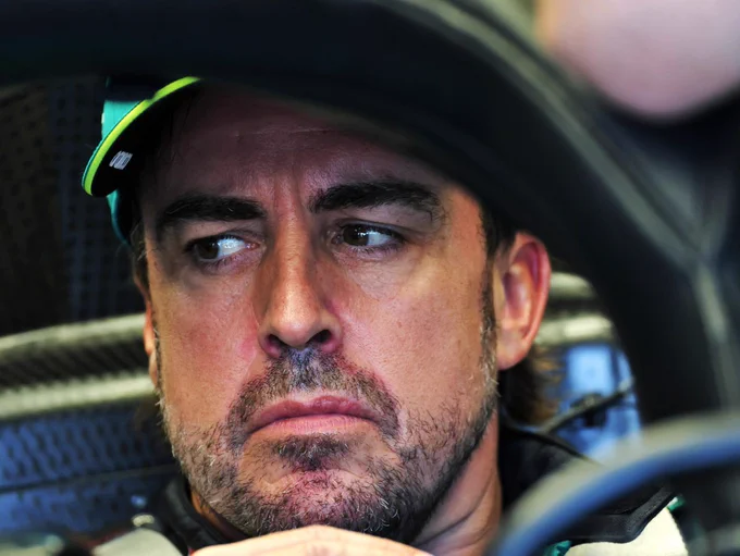 Fernando ALonso looking out of his car
