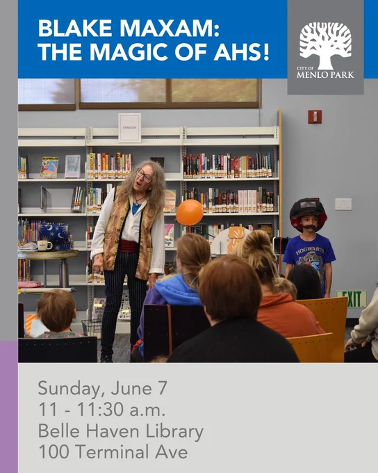 Inside a library, with a wall of books behind her and a young volunteer to her side, a magician makes a face and hangs her head.