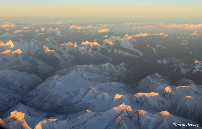 Sunrise over the mountains, clicked from Delhi Leh Flight!