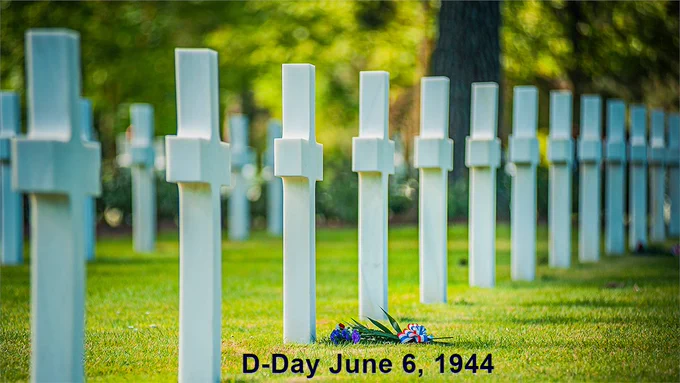 A row of crosses at a World War 2 cemetery.