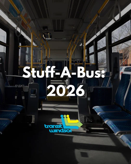 Interior view of an empty city bus with blue seats and yellow handrails, promoting Stuff-A-Bus 2026 by Transit Windsor.