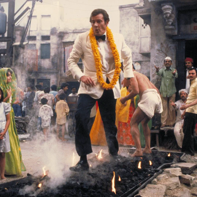 James Bond (Roger Moore) walks across hot coals in Octopussy.
