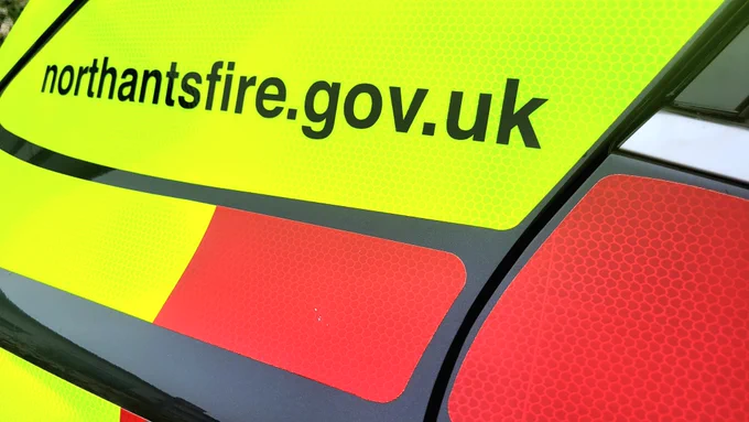Northants Fire and Rescue Service vehicle with "northantsfire.gov.uk" text on high-visibility yellow.