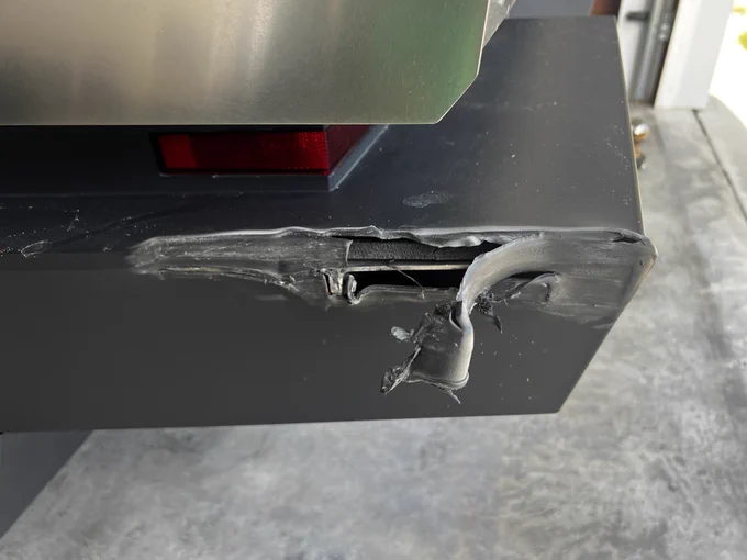 Someone hit our Cybertruck. Peeled the plastic back on the bumper. No body damage though