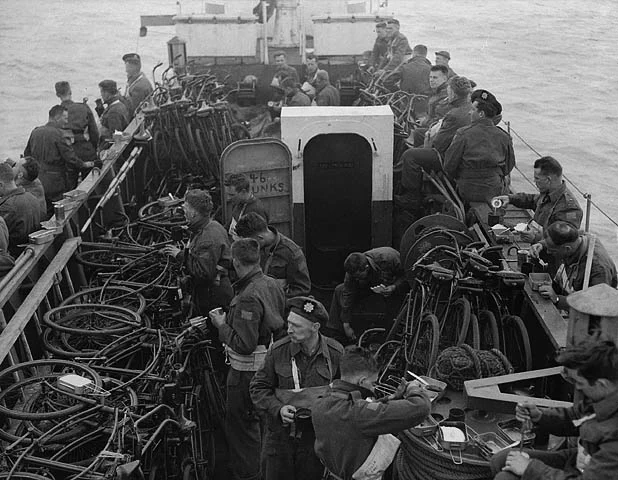 World War II soldiers aboard a naval ship.