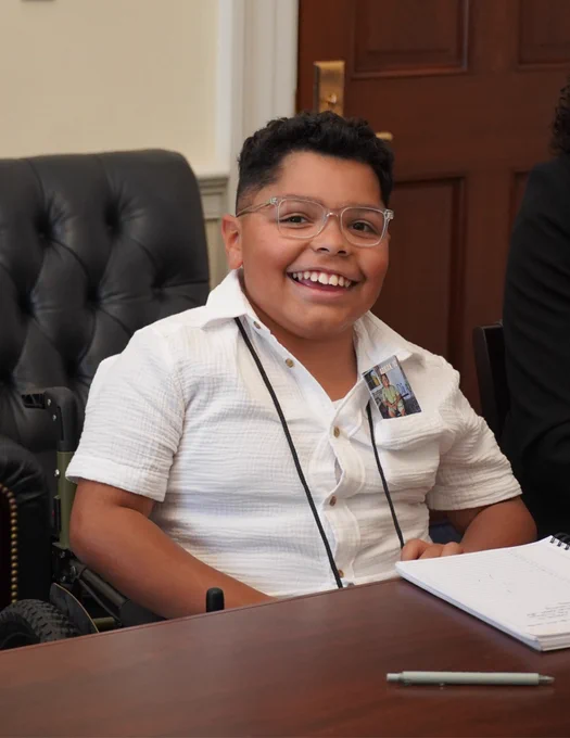A photo of Adrian smiling.