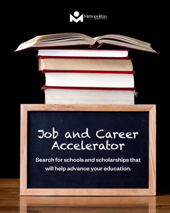 Stack of books with an open book on top behind a chalkboard promoting Job and Career Accelerator for education and career advancement.
