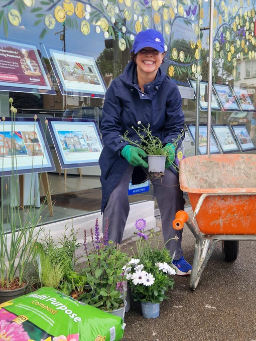 Getting ready to plan - Sue wixley with plants and wheel barrow on southfields high street