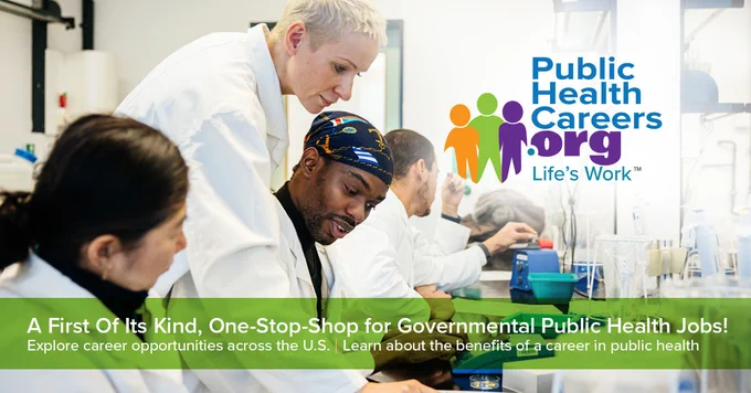 Laboratory personnel in white coats are engaged in a collaborative task, using lab equipment. They are focused on their work, surrounded by scientific instruments. The image promotes PublicHealthCareers.org with the tagline "Life's Work," and has a banner encouraging exploration of public health career opportunities in the U.S.