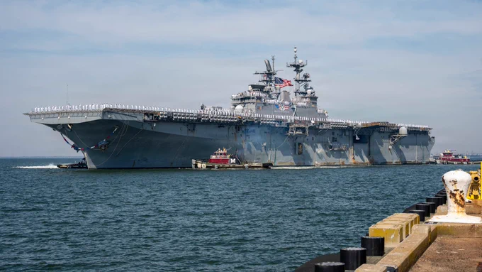 NORFOLK, VA. (June 6, 2026) Wasp-class amphibious assault ship USS Iwo Jima (LHD 7) returns to Naval Station Norfolk following a 10-month deployment as part of the Iwo Jima Amphibious Ready Group (IWO ARG). Iwo Jima, the flagship of the IWO ARG, deployed to the Caribbean in support of U.S. Southern Command, Department of War-directed operations, and the president’s priorities to disrupt illicit drug trafficking and protect the homeland. (U.S. Navy photo by Mass Communication Specialist 3rd Class Greggory Fisher)